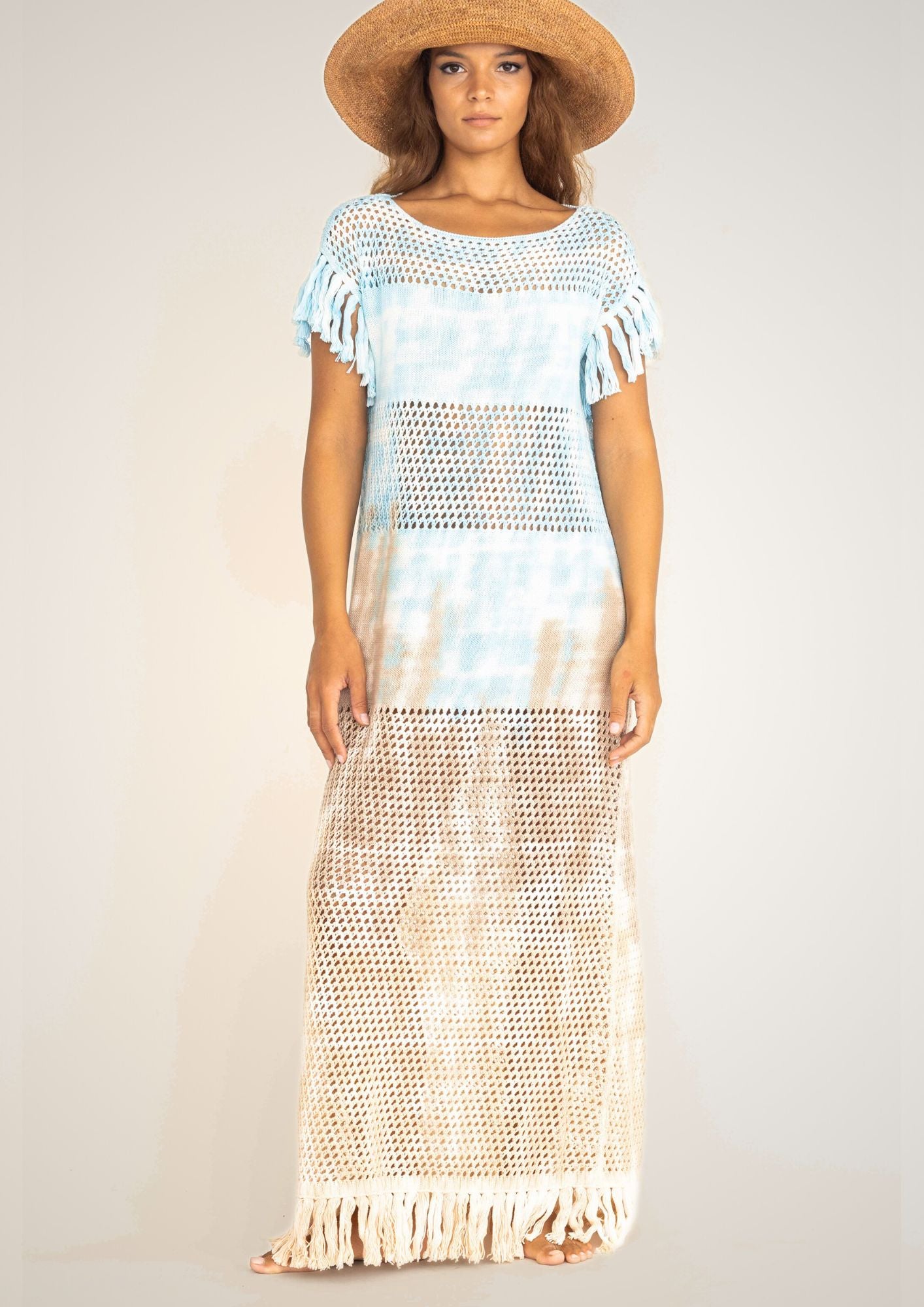 Handcrocheted mesh highend holiday dress in light blue and sand tiedye with fringes