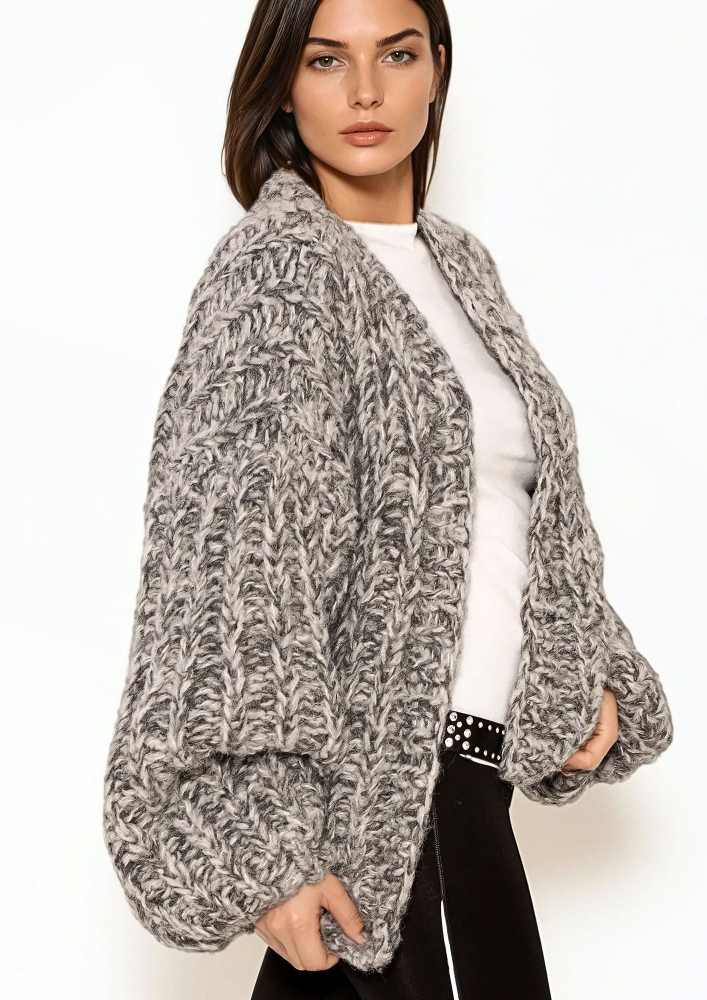 Girl with dark hair in white t shirt and grey melange handknitted oversized luxury mohair cardigan