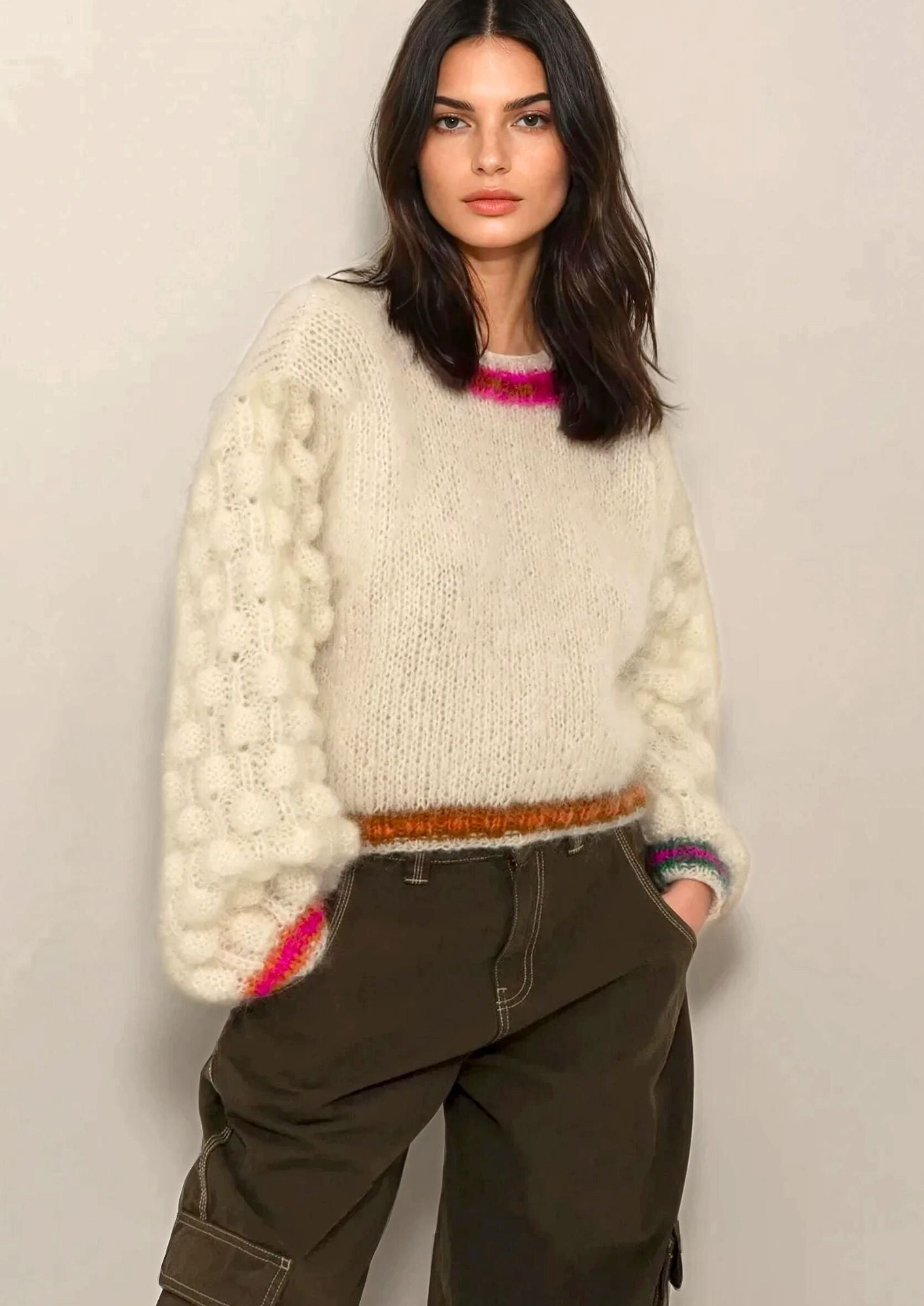 beautiful brown hair girl in handknitted white mohair sweater with colored borders