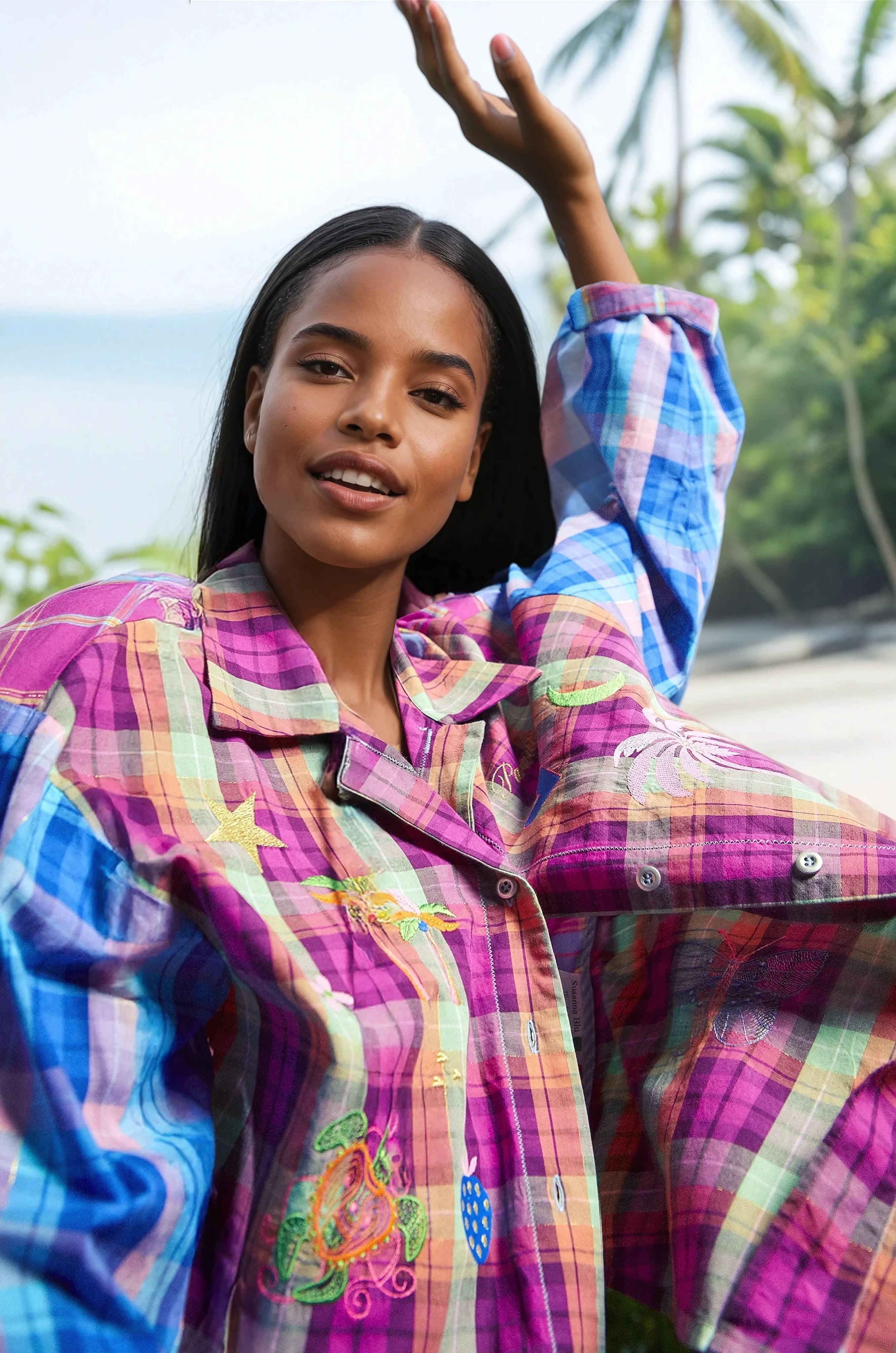 Dark beautiful girl wearing a colorful Susanna blue shirt