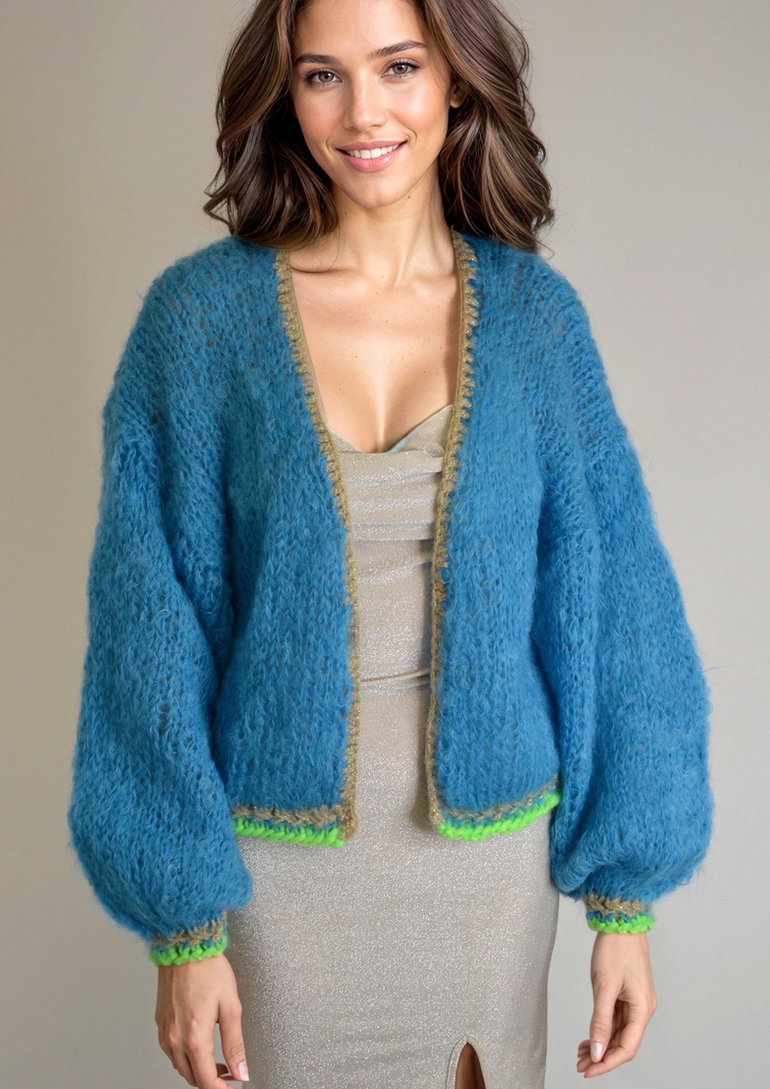 Girl in a lurexdress and a handknitted blue jacket