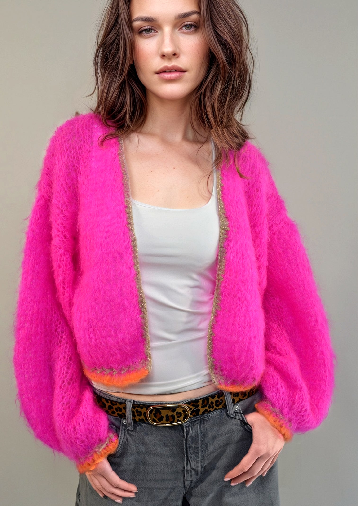 Girl in a jeans and a handknitted hotpink jacket