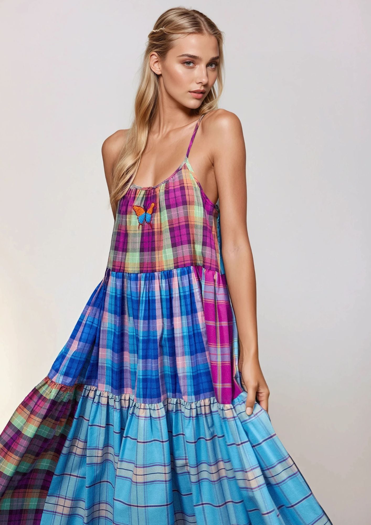Beautiful Blonde girl wearing a Susanna Blu dress wih Gingham colorfabric and butterfly embroidery 3