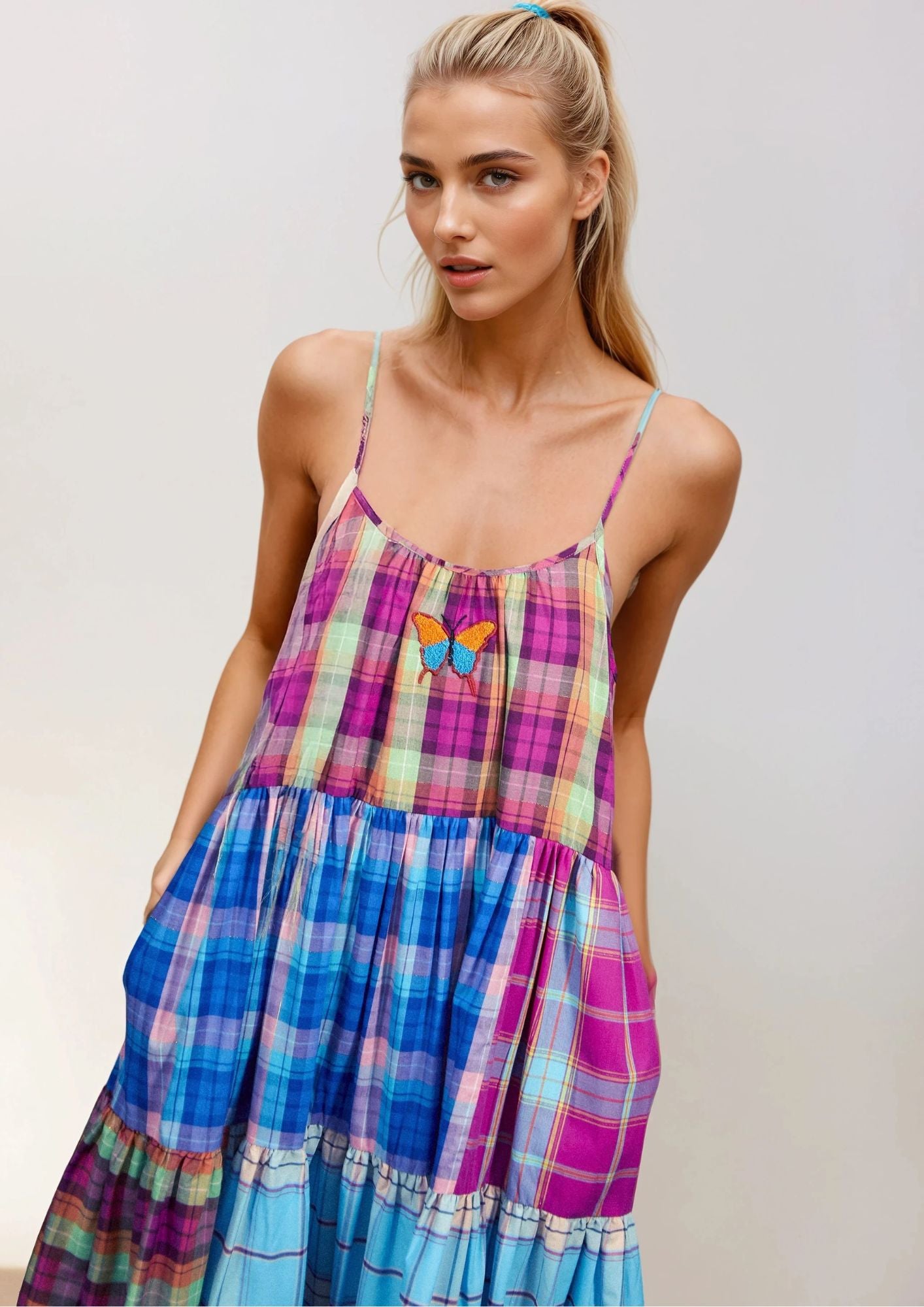 Beautiful Blonde girl wearing a Susanna Blu dress wih Gingham colorfabric and butterfly embroidery 4