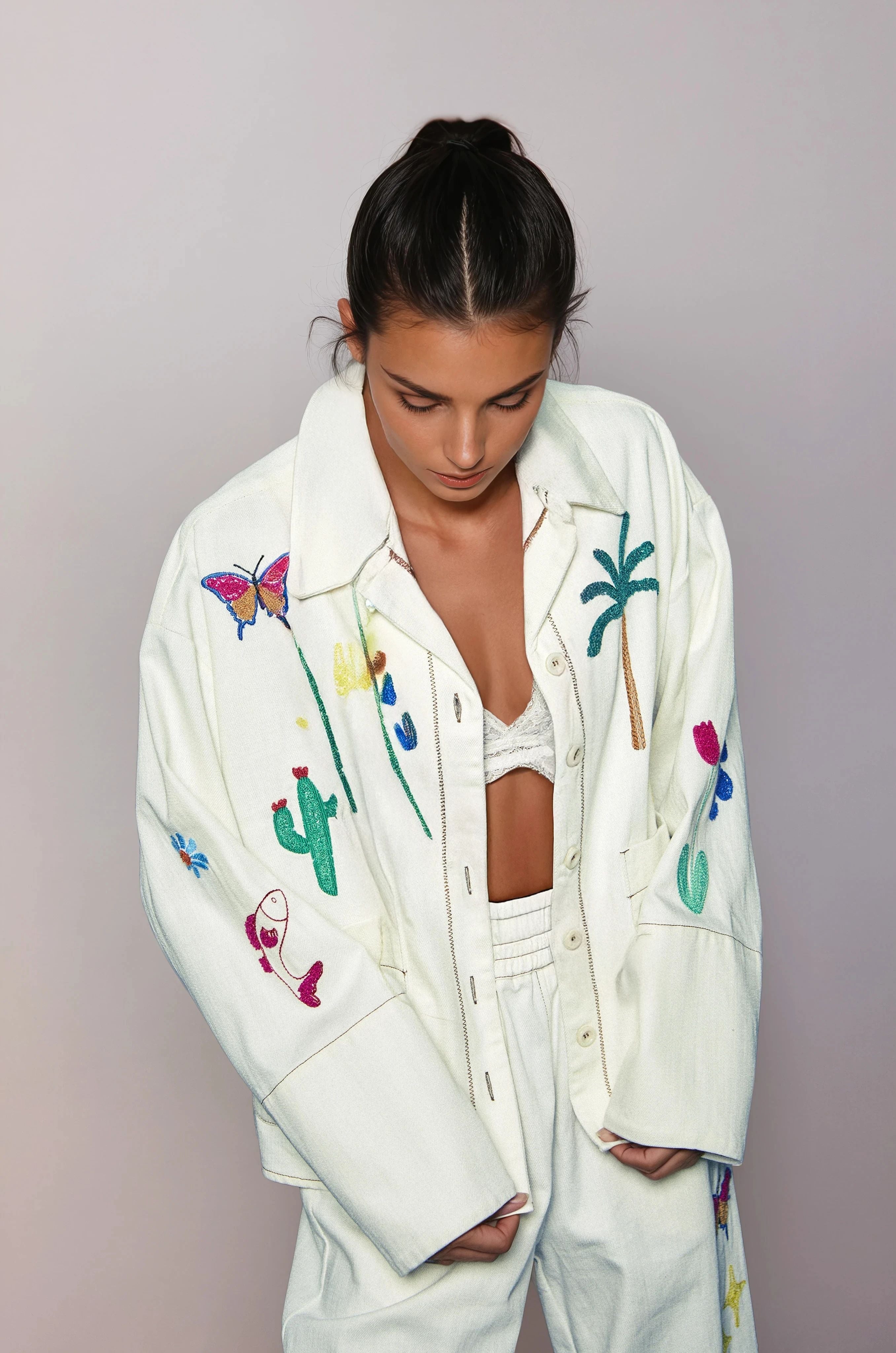 Girl in a white jacket with embroideries