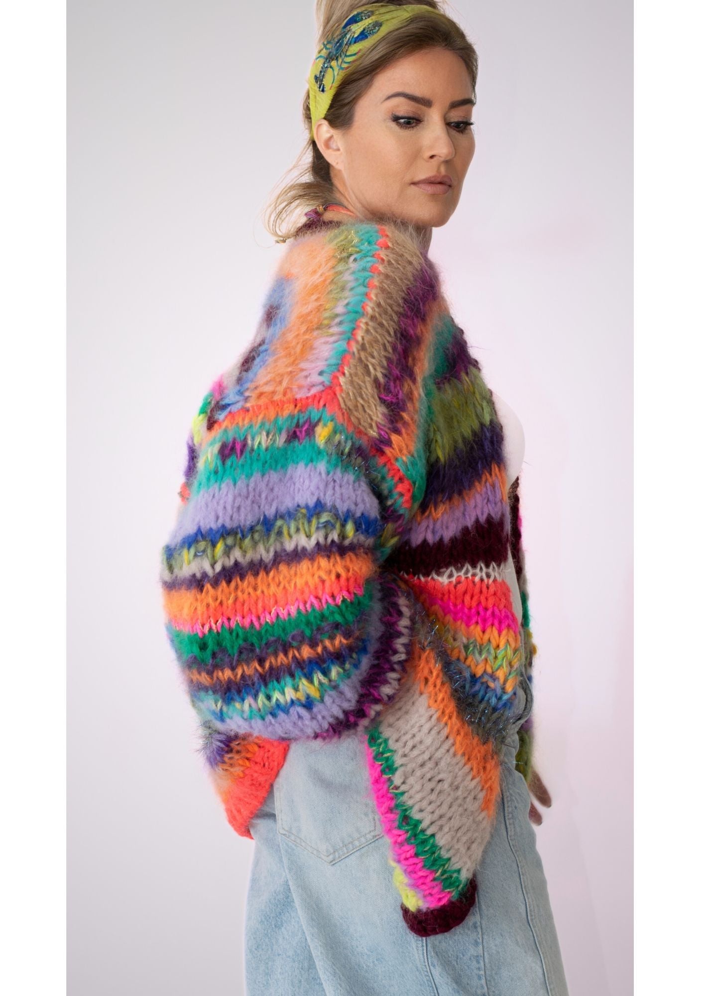 Woman in handknitted multicolor cardigan kittyvanCoesant.official sideview