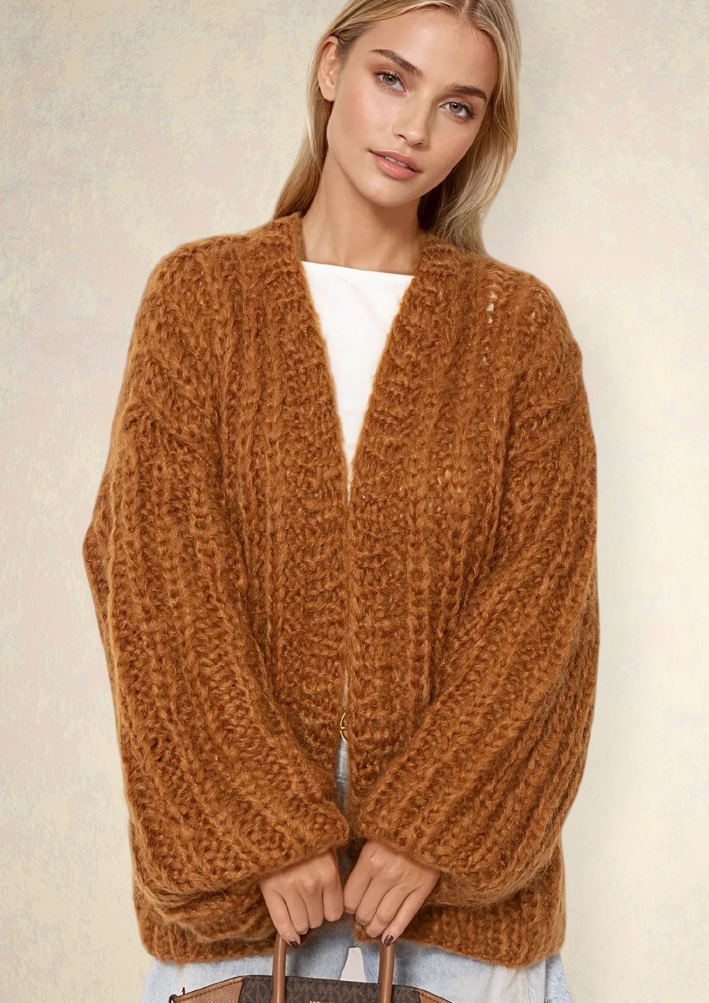 blonde girl in handknitted chunky cardigan in brown