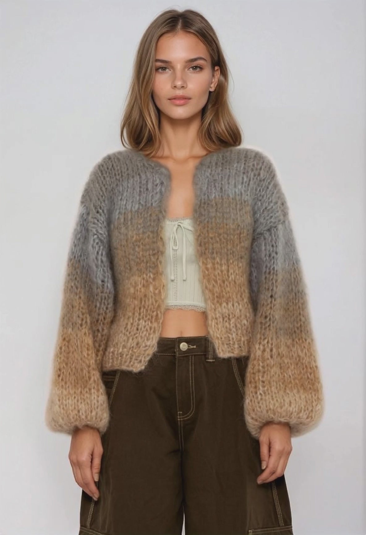 video of a woman in a handknitted gradient brown grey sweater